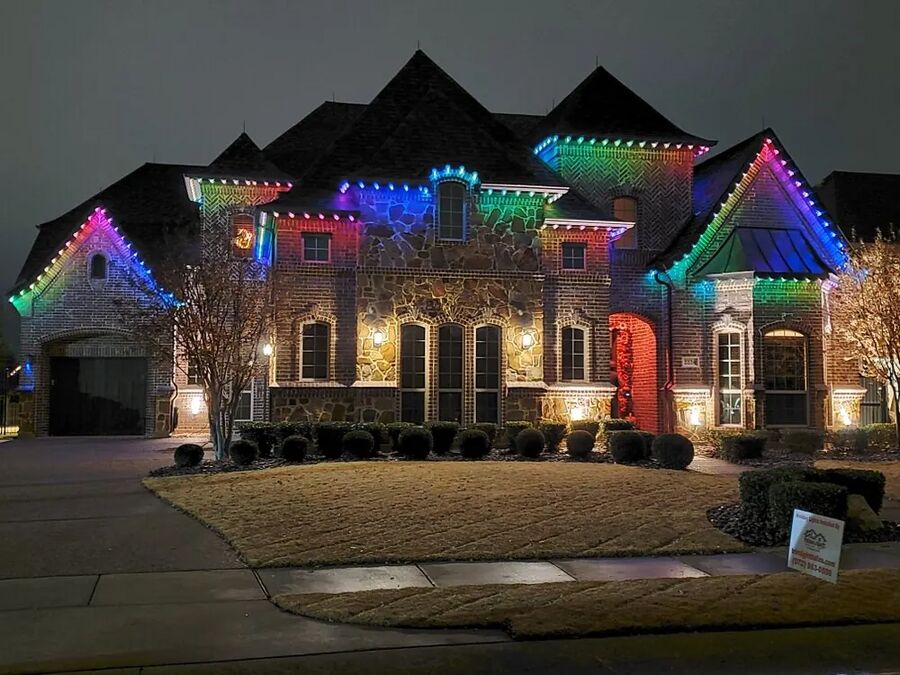 House outlined with permanent multicolour holiday lights
